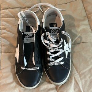 Black Golden Goose sneakers.